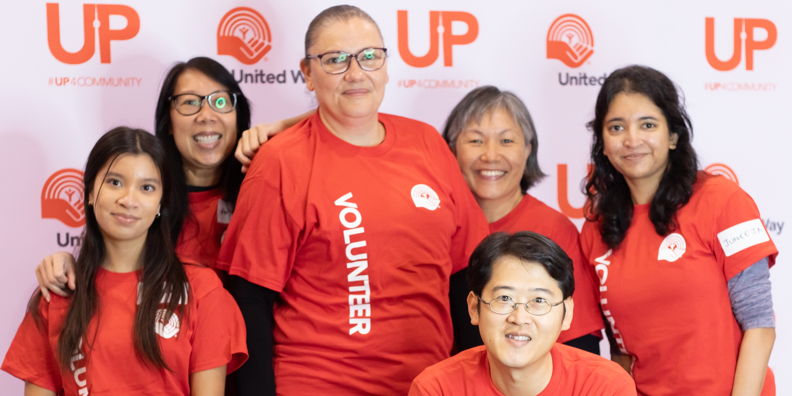 A group of people smiling at United Way's ClimbUP event